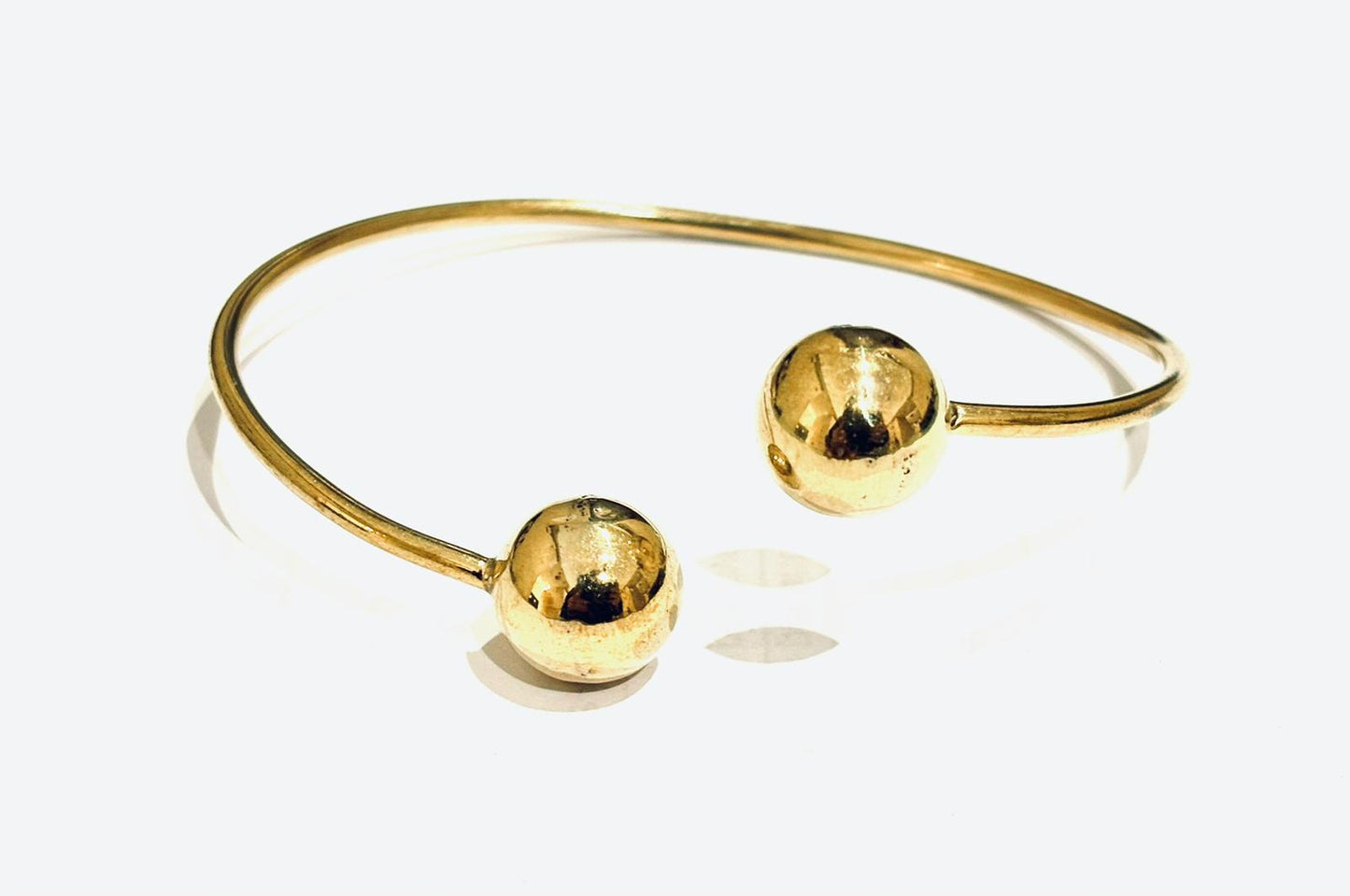 BRACCIALE CON SFERE OTTONE